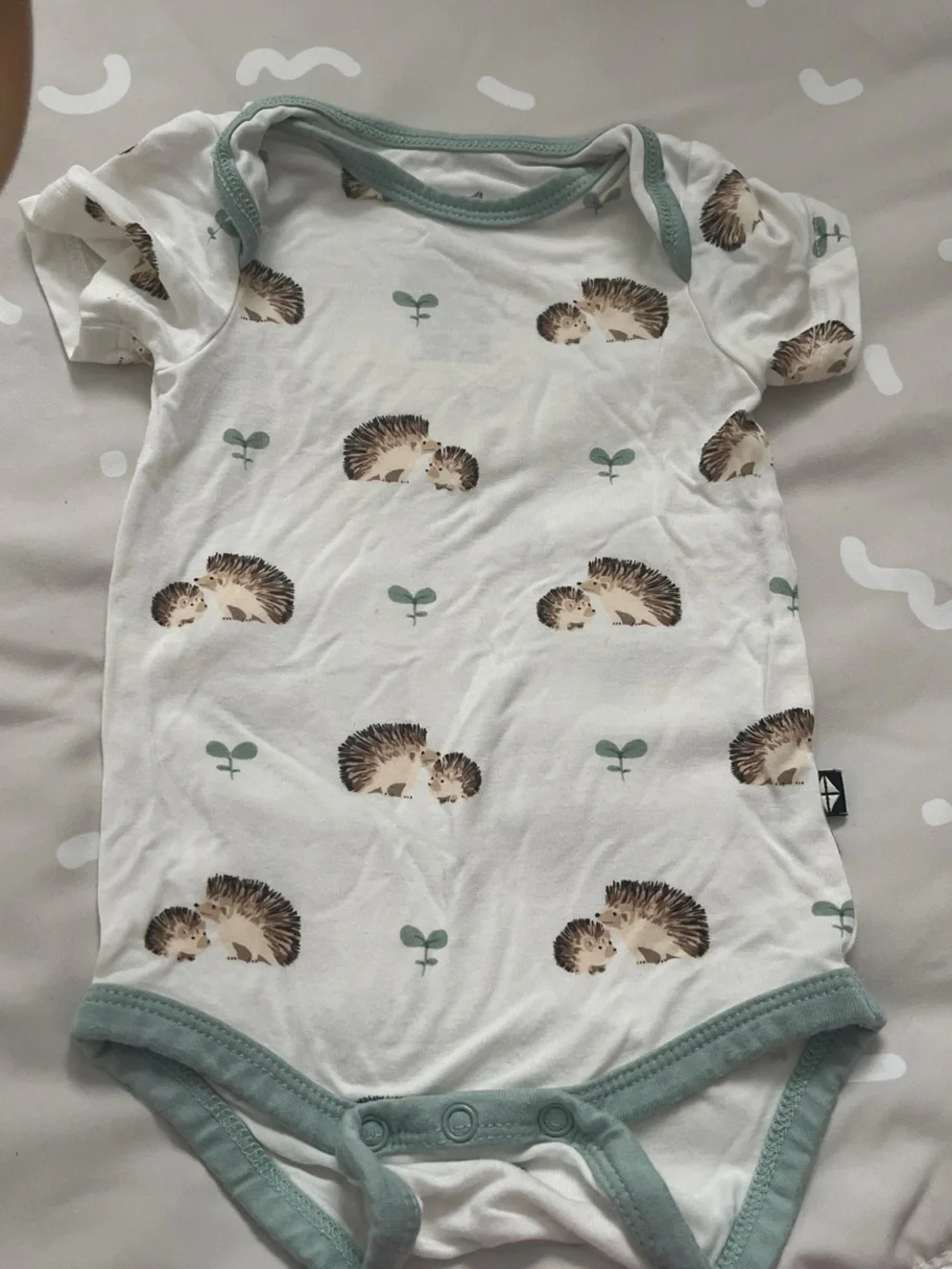 Kyte BABY White Bodysuit with Hedgehog Print and Sage Trim